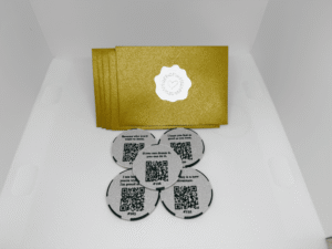 Set of 5 Share This Forward Kindness Tokens with unique uplifting messages and QR codes, each paired with a golden envelope sealed by a silver heart sticker — ready to inspire and spread kindness forward