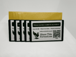 Set of 5 Share This Forward Kindness Notes with matching golden envelopes, featuring uplifting affirmations and scannable QR codes to inspire kindness and track each token’s journey